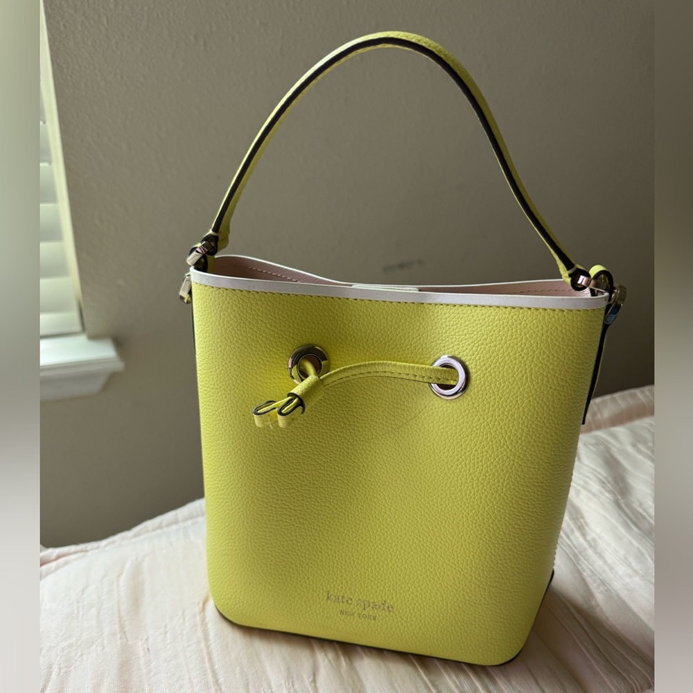 Yellow Kate Spade bucket bag.